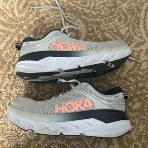 Hoka Gray and White Sneakers with Orange Highlights